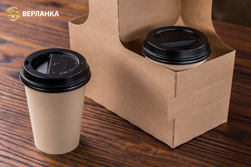 Paperboard cup holders with handles for 2 cups and bamboo paper hot cups.